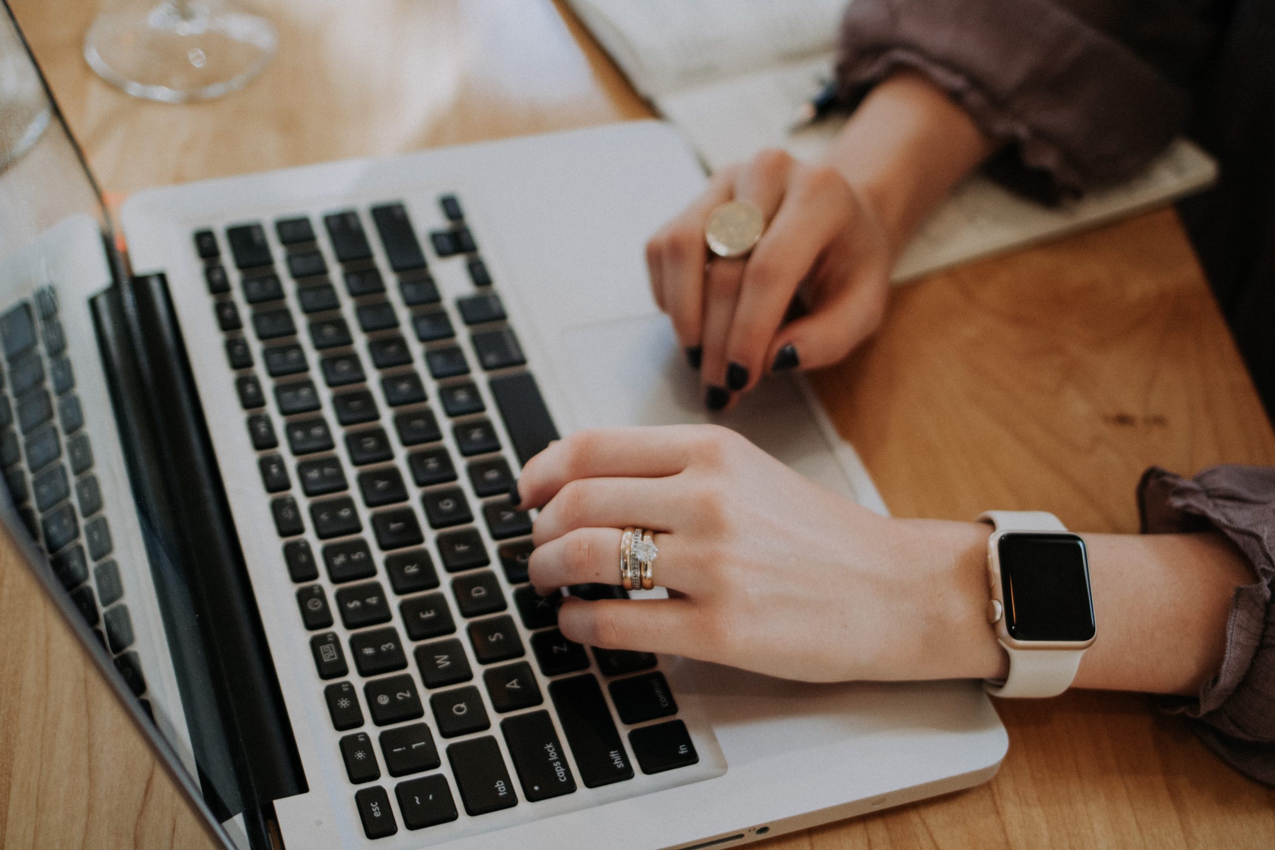 Woman's Hands on Laptop Keyboard