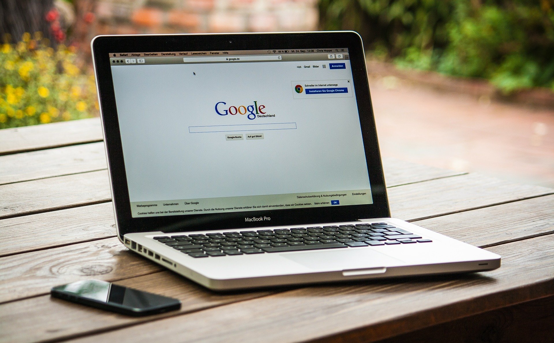 Google Search on Silver MacBook Air Located on Light Wooden Table