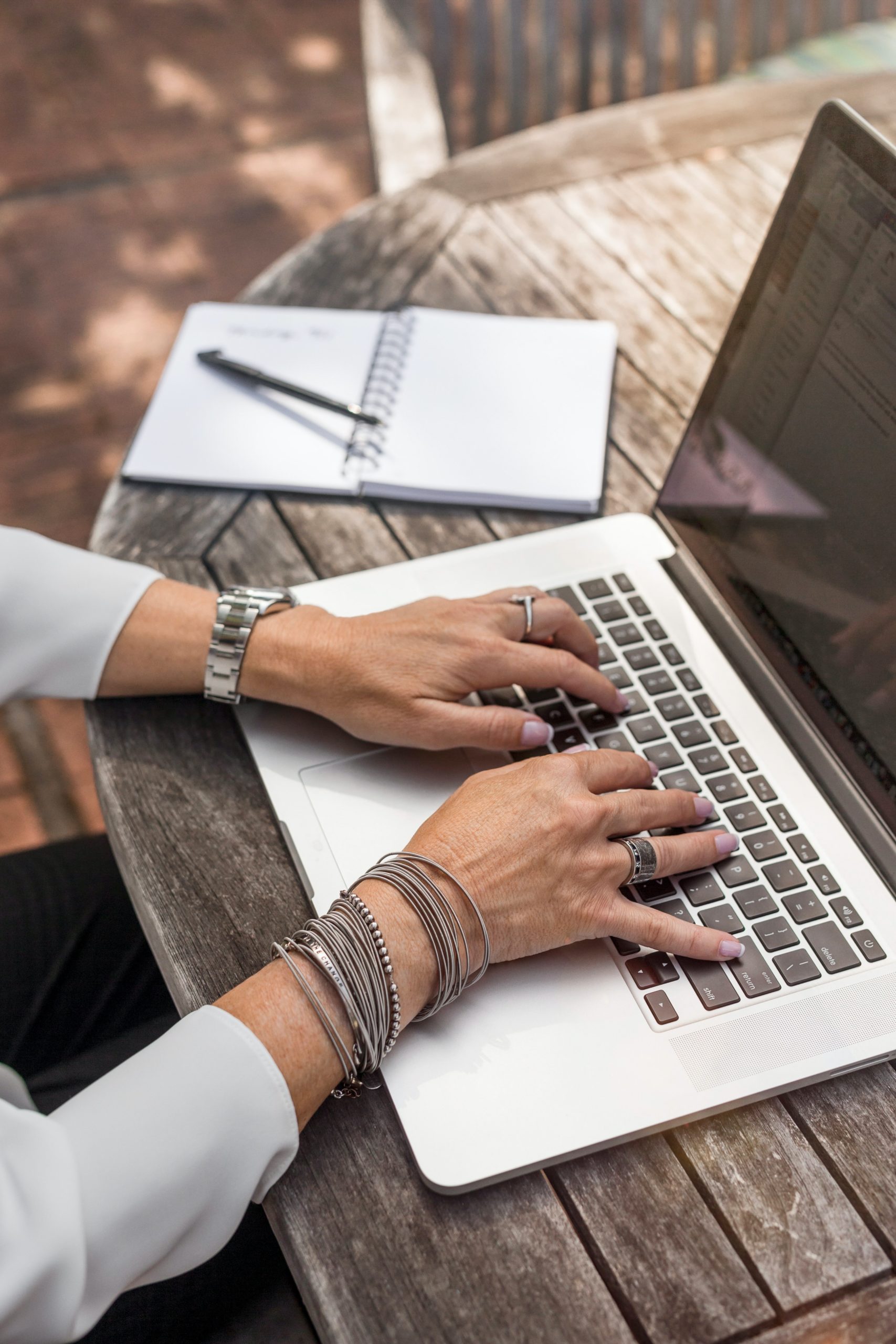 Woman's Hands on Laptop Keyboard