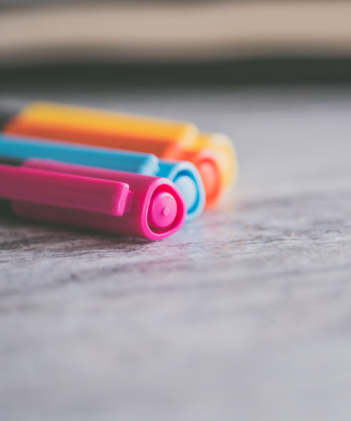 Pink, Blue, and Orange Markers Next to One Another