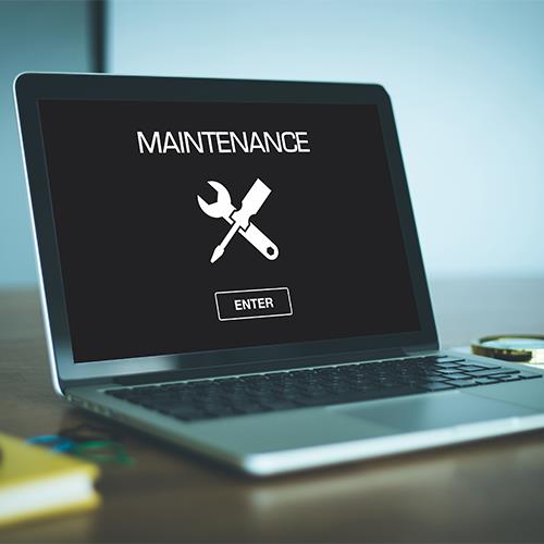 Website Maintenance Screen on Laptop