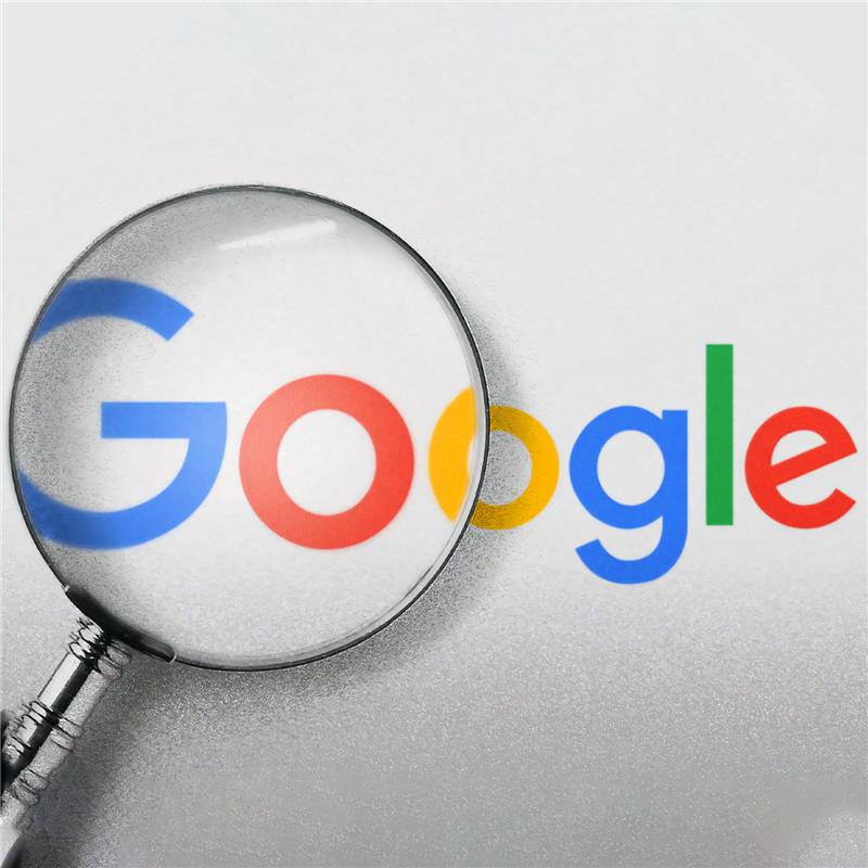 Google Logo Under Magnifying Glass