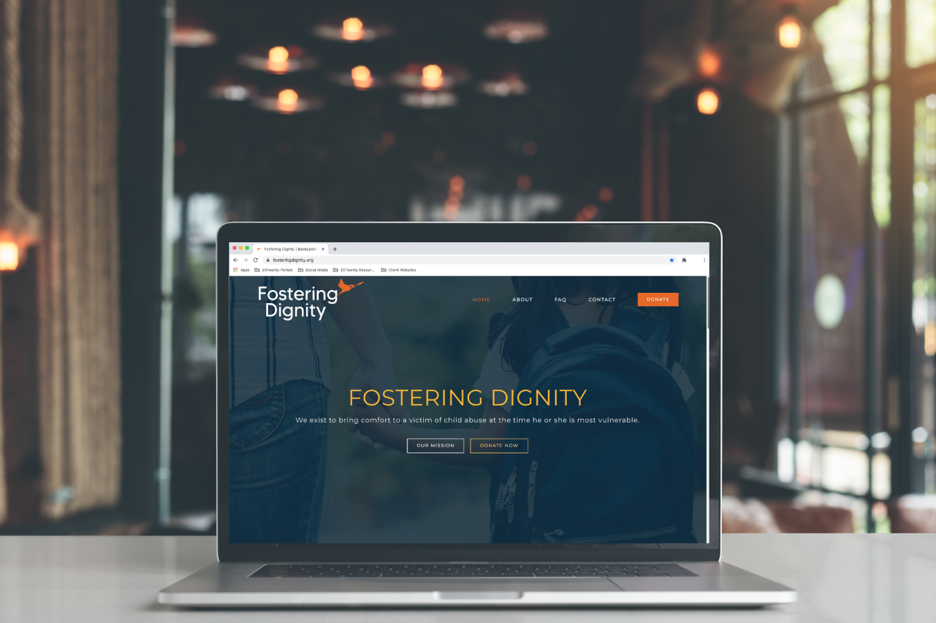 Fostering Dignity Website Design on Laptop