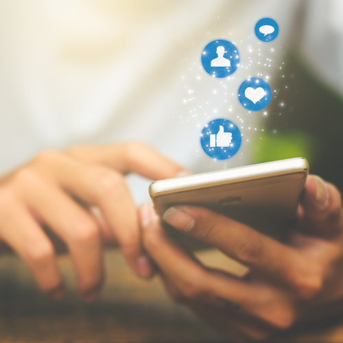 Close up of Woman's Hands Using Smartphone with Social Media Icons