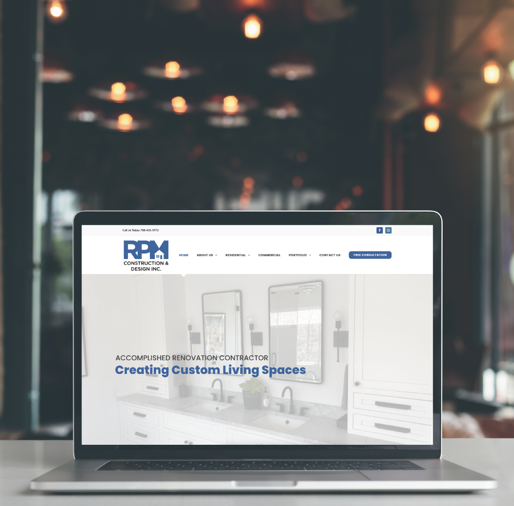 RPM Construction & Design Website on Laptop Screen