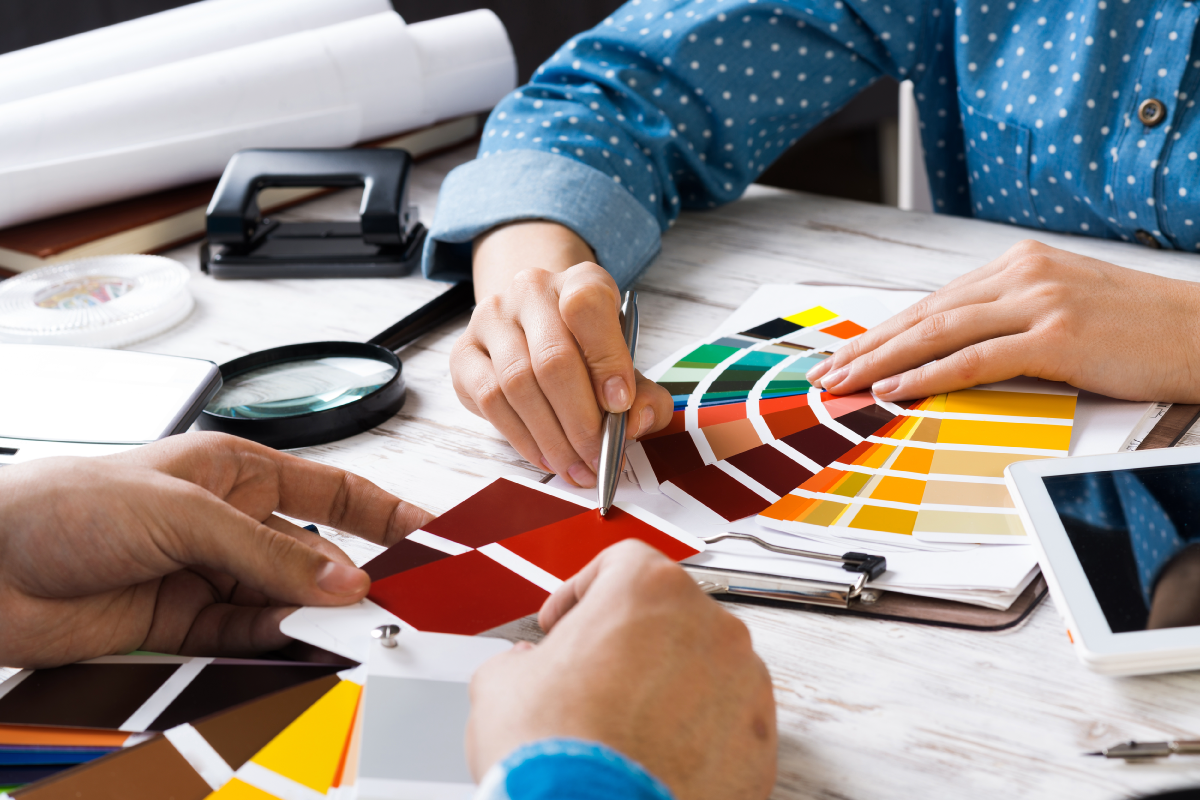 Pantone Color Formula Guide Spread Out on Whitewash Wooden Table