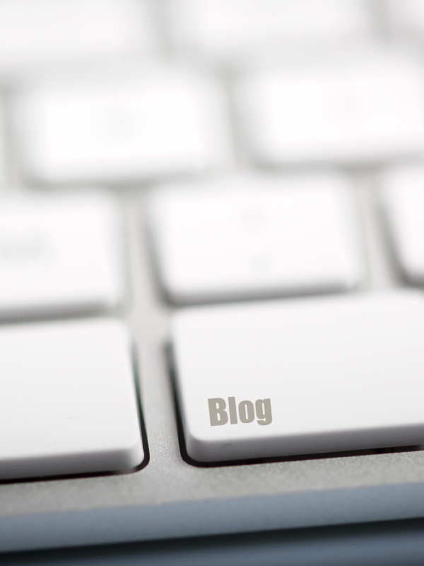 The word "BLOG" written on metallic keyboard