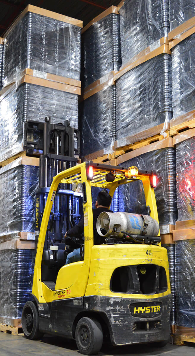 Active Forklift Inside of Warehouse